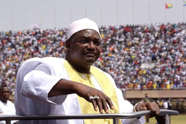 Gambian President Adama Barrow looks at the audience from the opened roof of a car as he arrives at the Independence Stadium in Bakau for the inauguration ceremony, on February 18, 2017. Barrow has promised to reform the National Intelligence Agency. PHOTO | SEYLLOU | AFP